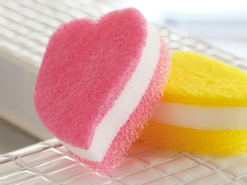 Heart-shaped kitchen sponges on a dish rack